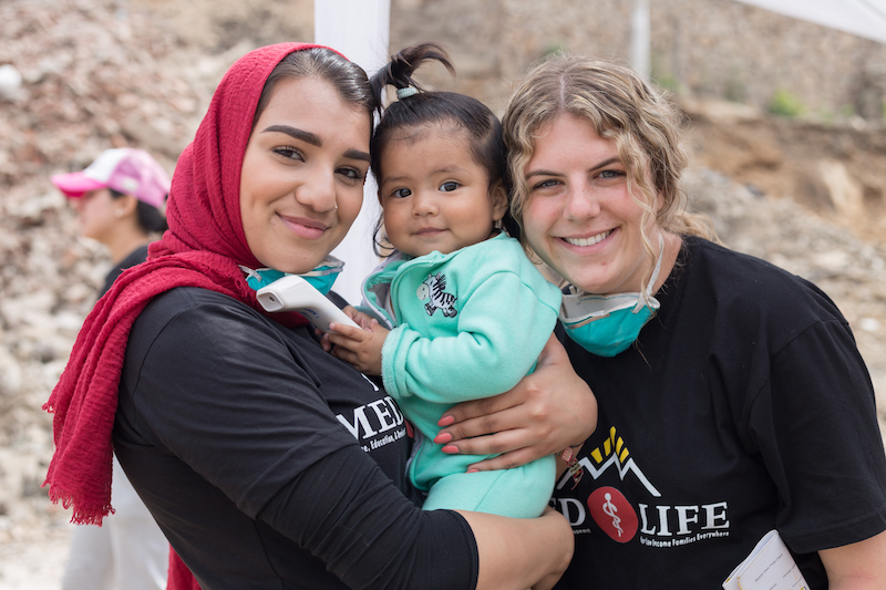 Volunteers with baby