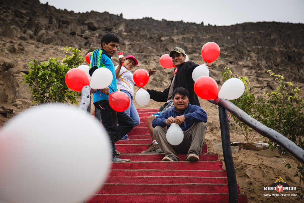 Community members from 15C work on decorating the newly completed staircase before inauguration.